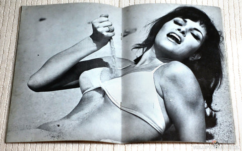 Raquel Welch Centerfold Pouring Sand on Breasts