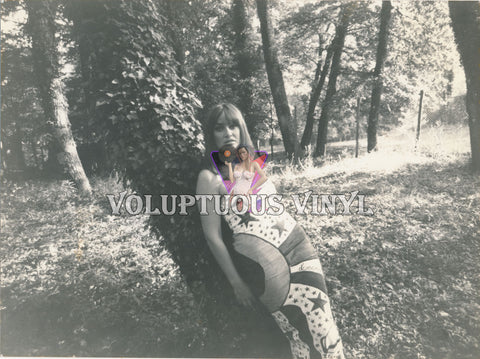 Marisa Mell Leaning Up Against Ivy Cover Tree photograph